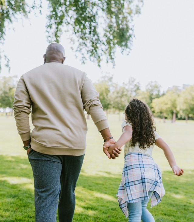 man and daughter in park
