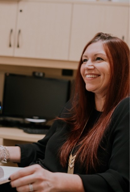 A woman smiling