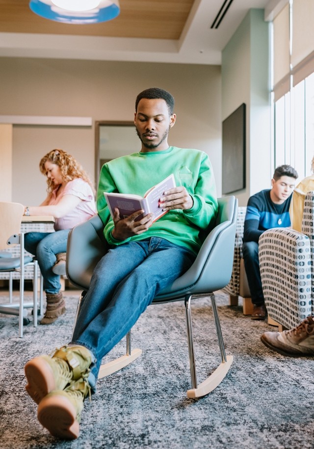 Man sitting and reading literature