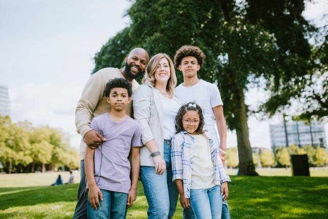 A family standing together outdoors