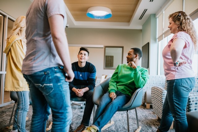 A group of patients talking indoors