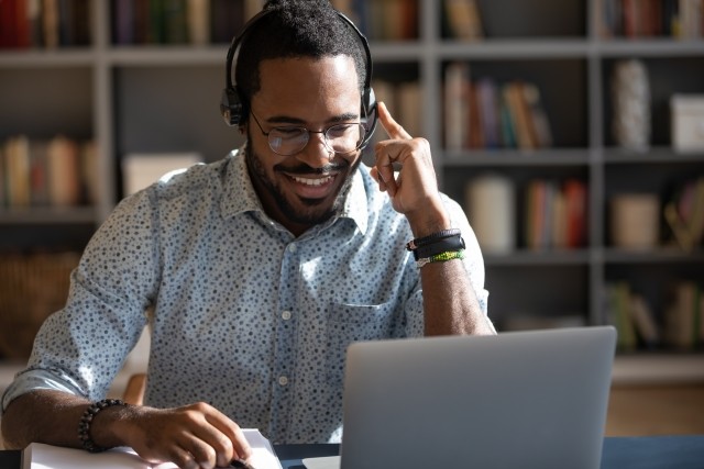 A man participated in virtual care programming on his computer