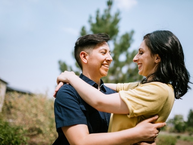 A female couple outdoors smiling