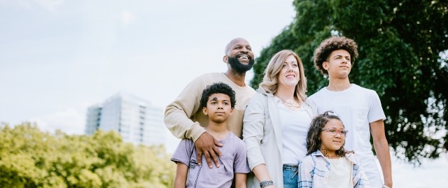A family outdoors in a park
