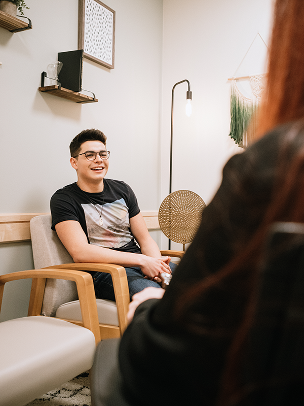 A male patient speaks with his therapist