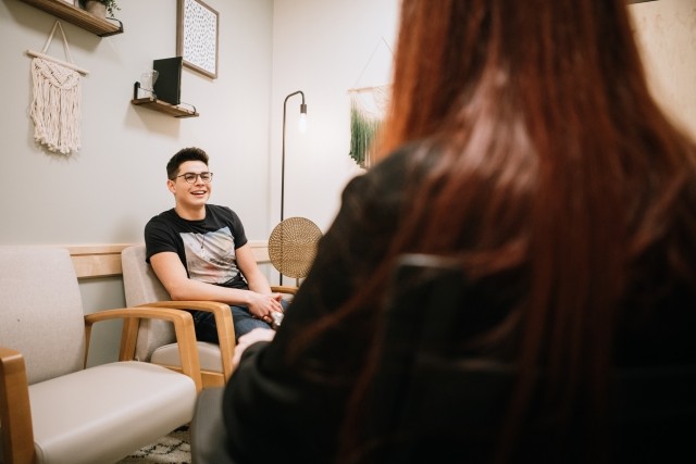 A male patient speaks with his therapist