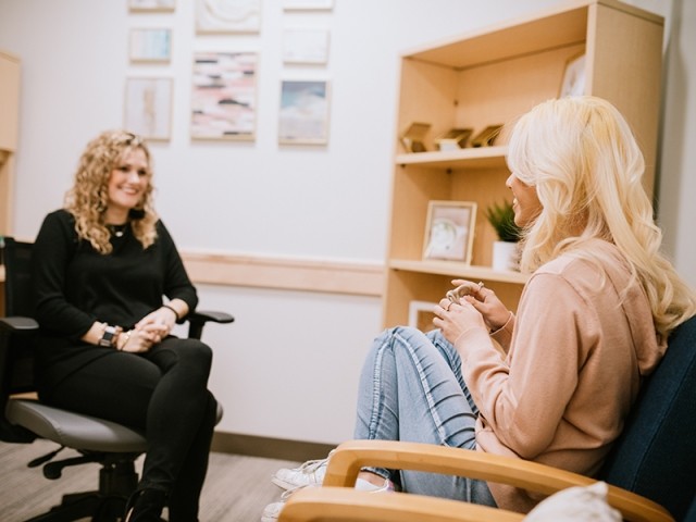 A therapist and patient together in an office