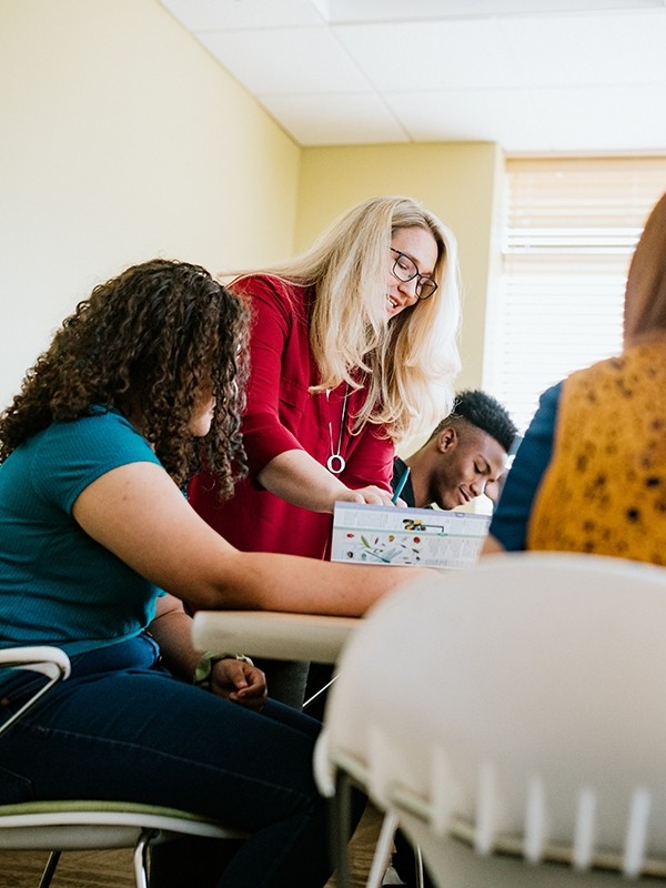 A group of patients work with an educational professional