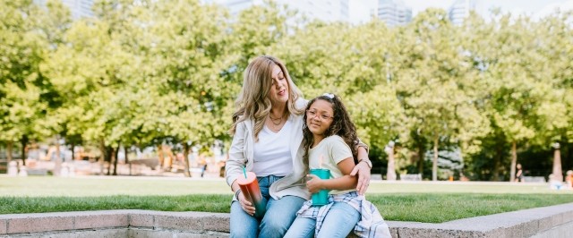 A mother is sitting with her daughter