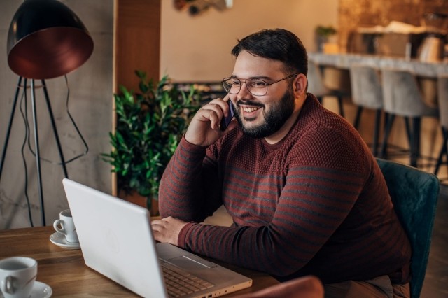 A young man on a computer