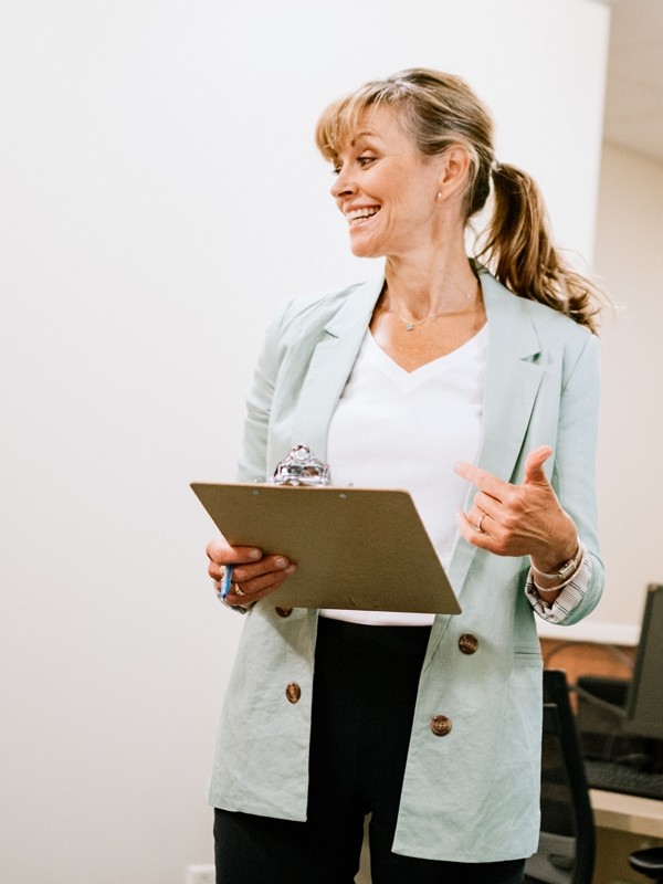 A clinician speaks with her colleagues