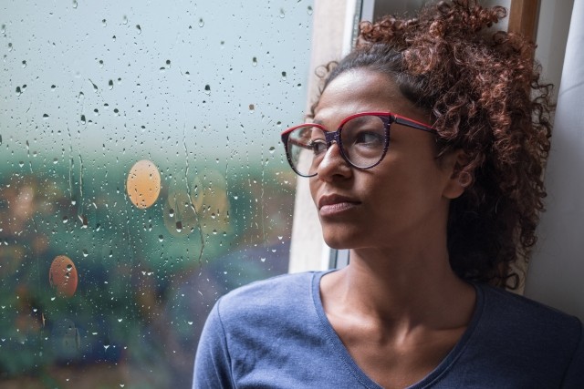 woman rainy window
