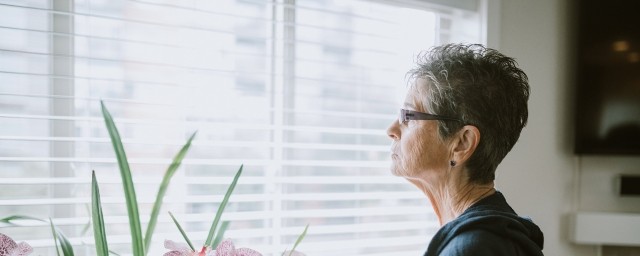 woman looking out window