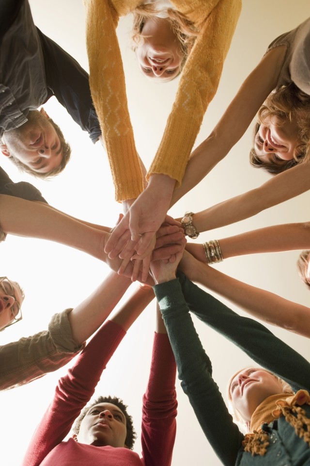 Group of people holding hands