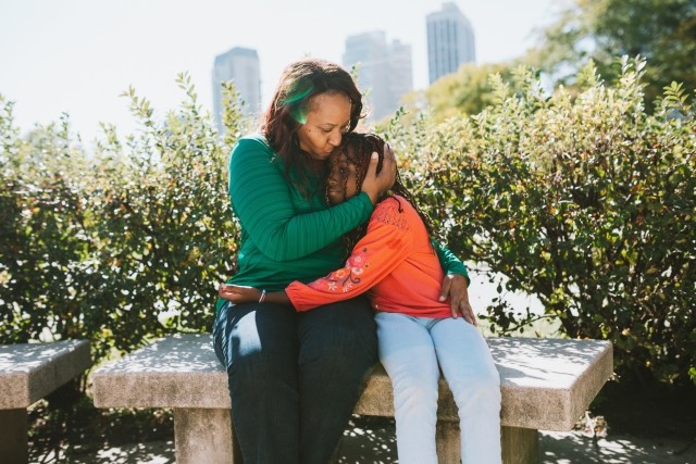 Mother daughter hugging