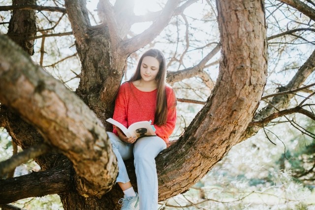 Person with ADHD and a mood disorder tries to concentrate while reading a book.
